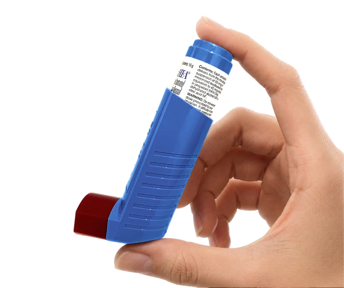 Side view of the Xopenex HFA inhaler held in a hand, with its parts labelled